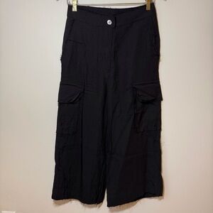 MM6 Maison Margiela Black pants raw edges on exposed seams pockets zip to Cole’s